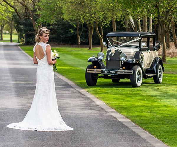 Wedding bride and vintage car